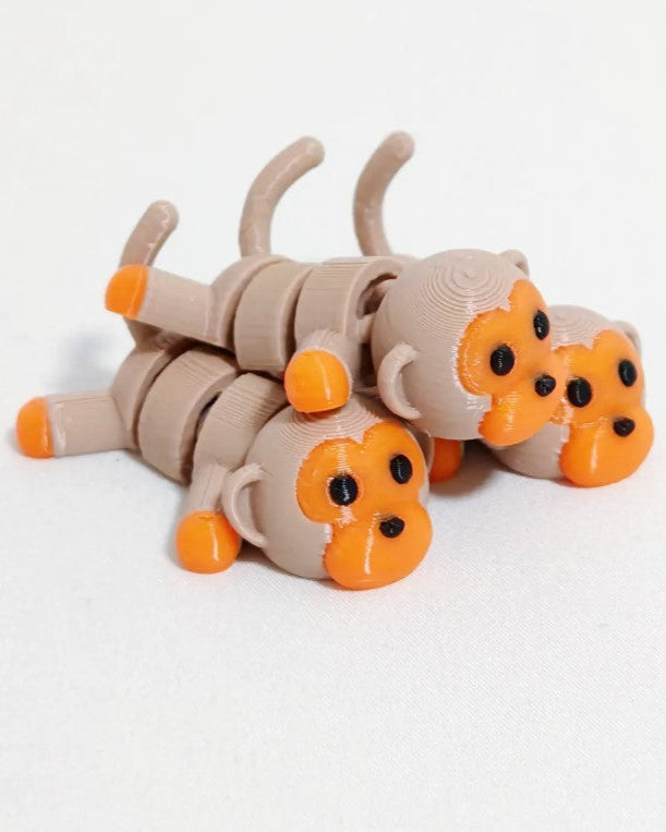 Toy caterpillar with orange segments on a white background