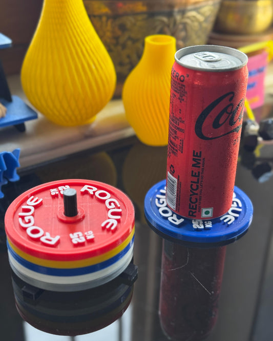 Red Coca-Cola can on a Rogue血液循环 bottle cap with yellow vases in the background