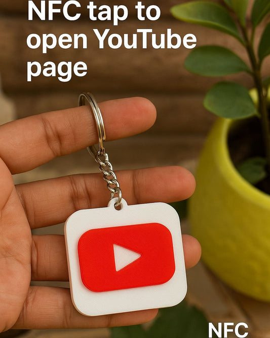 Keychain with YouTube logo held by a hand, with text about NFC functionality.