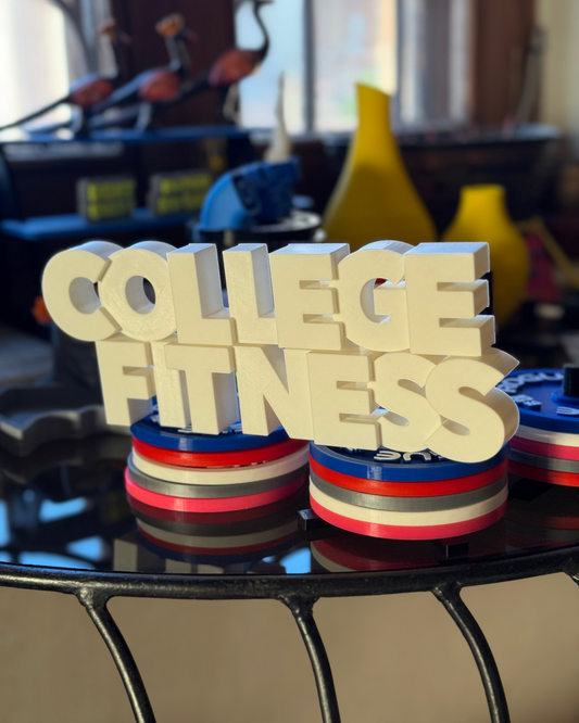 Wooden block letters spelling 'COLLEGE FITNESS' on a weight stack in a gym setting.