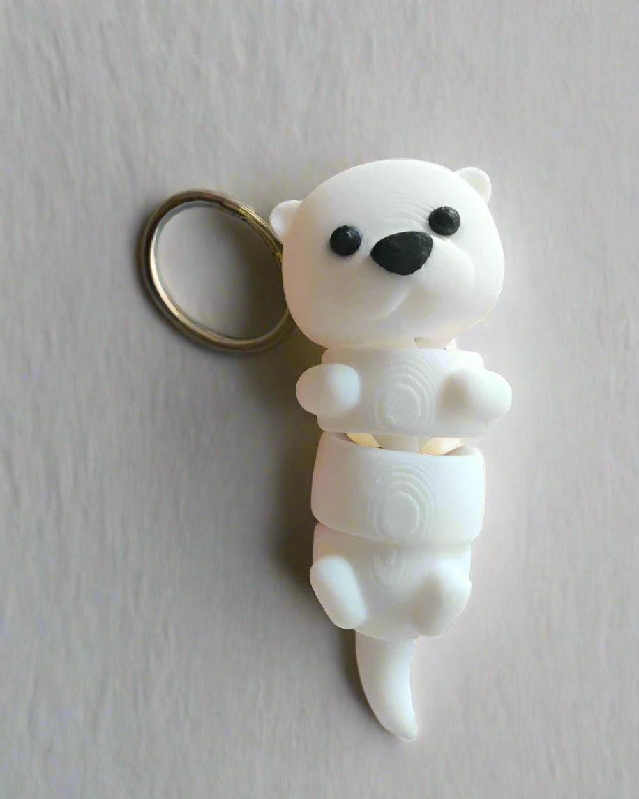 White polar bear figurine held in a hand with a blurred background