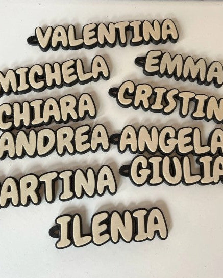 Wooden nameplates with names on a white background