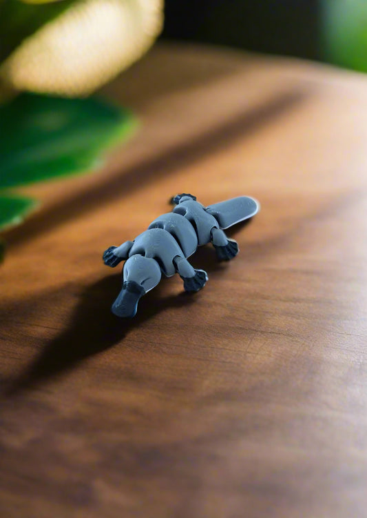 Plush toy alligator on a wooden floor