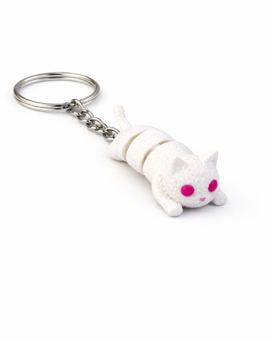 White cat-shaped keychain with pink eyes on a white background