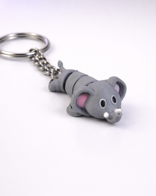Gray cat-shaped keychain on a white background