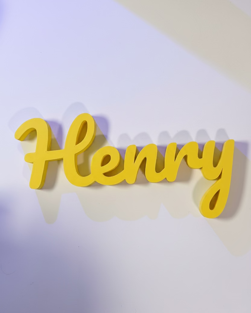 Yellow 3D text spelling 'Henny' on a white background