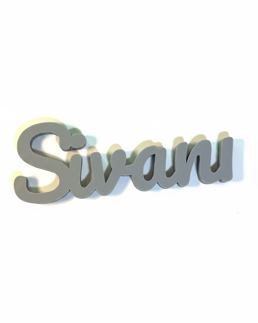Decorative nameplate with 'Sivani' on a light background