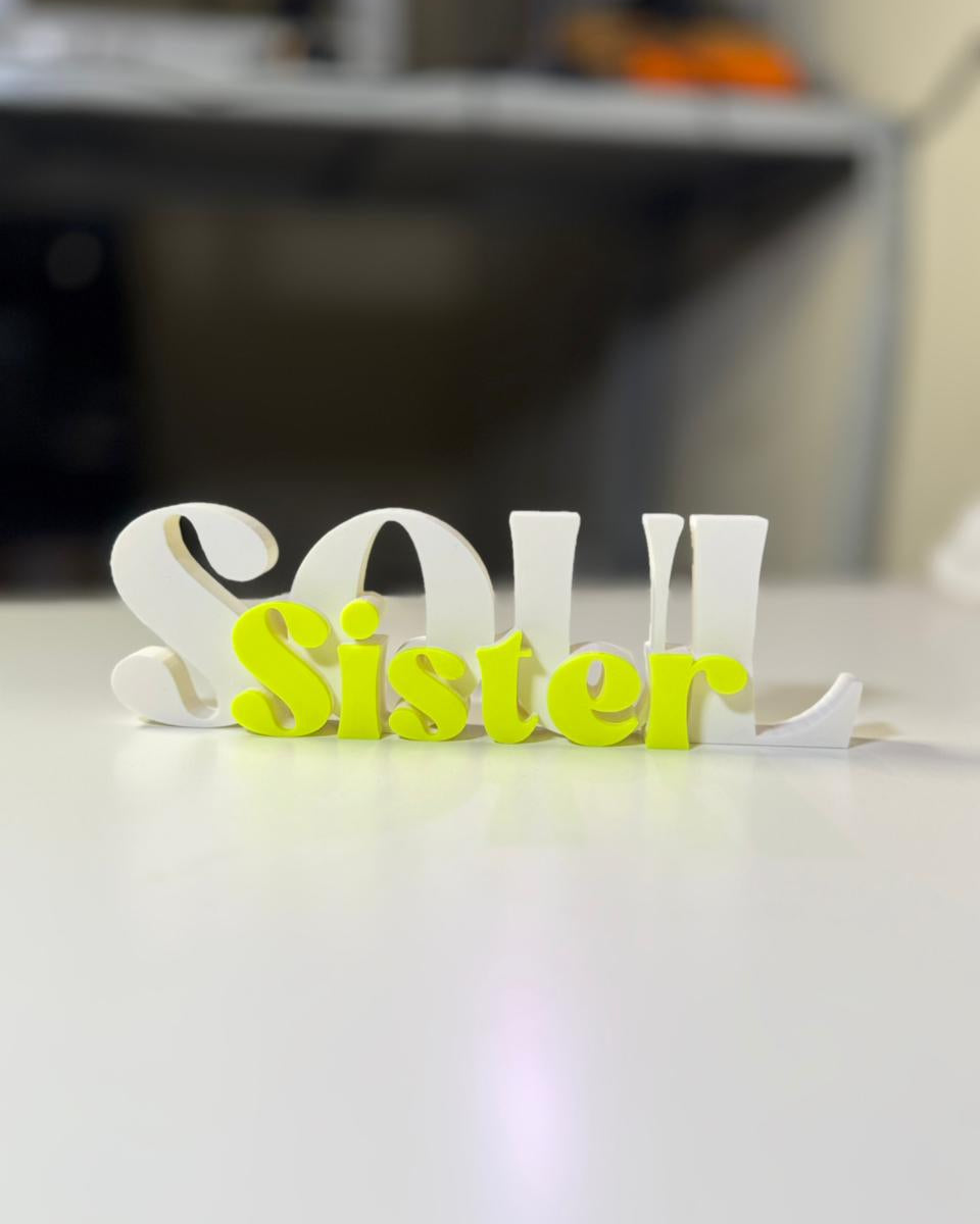3D printed decorative sign with 'Soul Sister' text on a blurred background