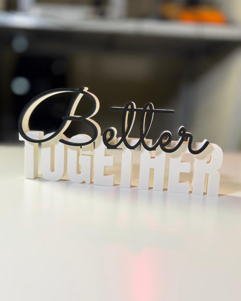 Decorative sign with 'Better Together' on a blurred background