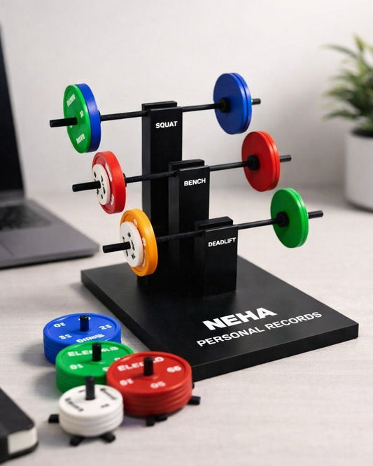 Neha Personal Records weightlifting barbell display with colorful weights on a desk.