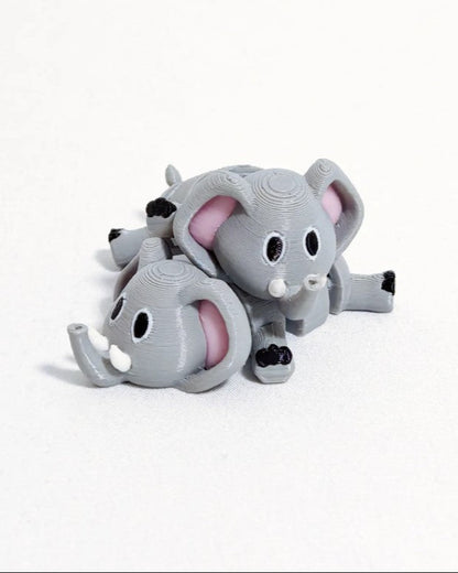 Gray elephant toy with pink interior on a white background