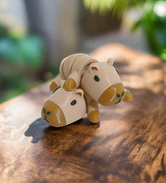 Toy figure of a camel on a white background