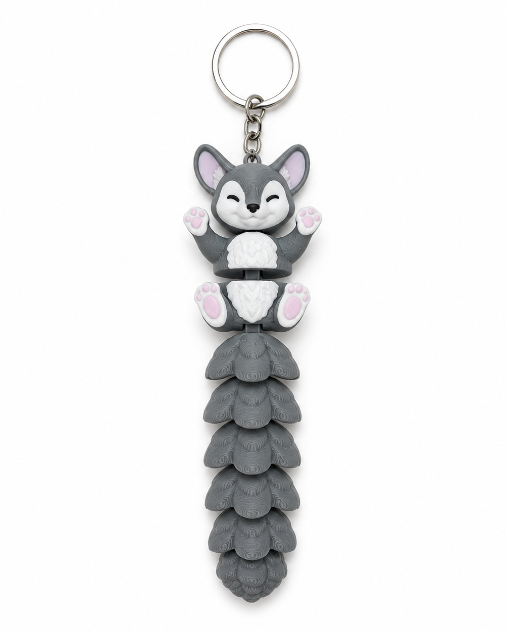 Keychain with a cartoonish fox design on a white background