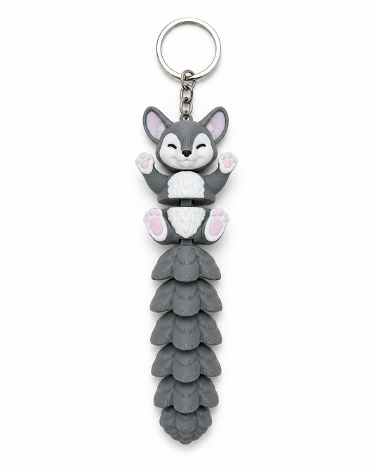 Keychain with a cartoonish fox design on a white background