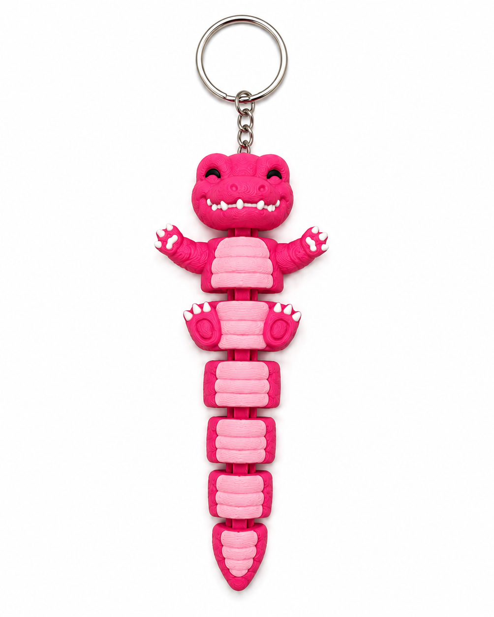 Pink dinosaur-shaped keychain on a white background