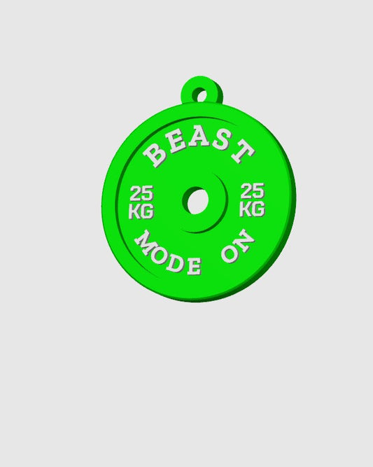 Green weight plate with 'BEAST MODE ON' text on a light gray background