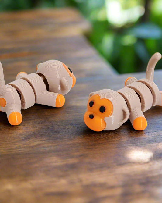 Two toy caterpillars on a white background