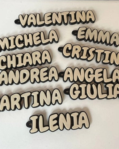 Wooden nameplates with names on a white background